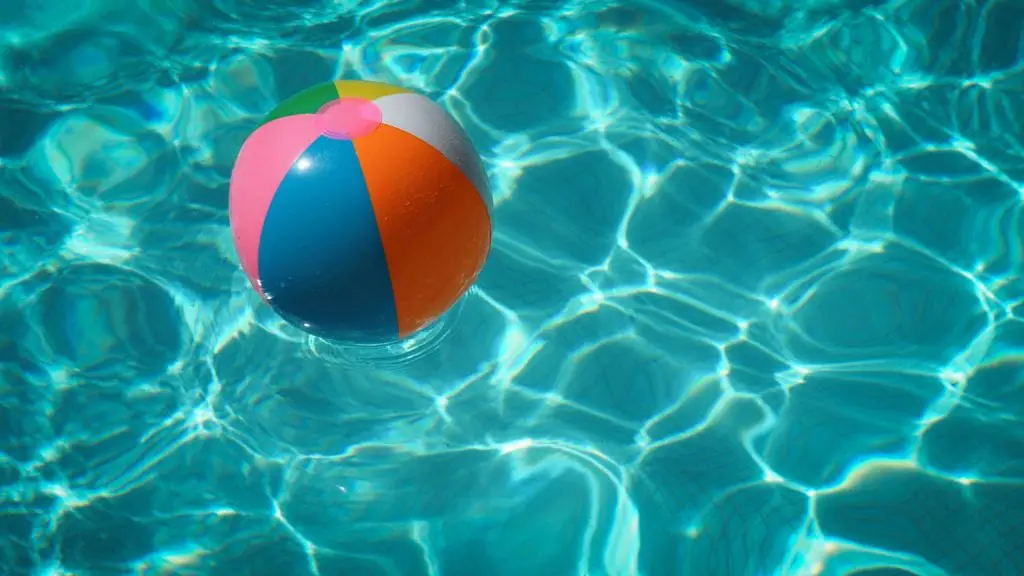 Beach ball floating in a clear pool.