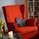 red living room chair, with purple pillow