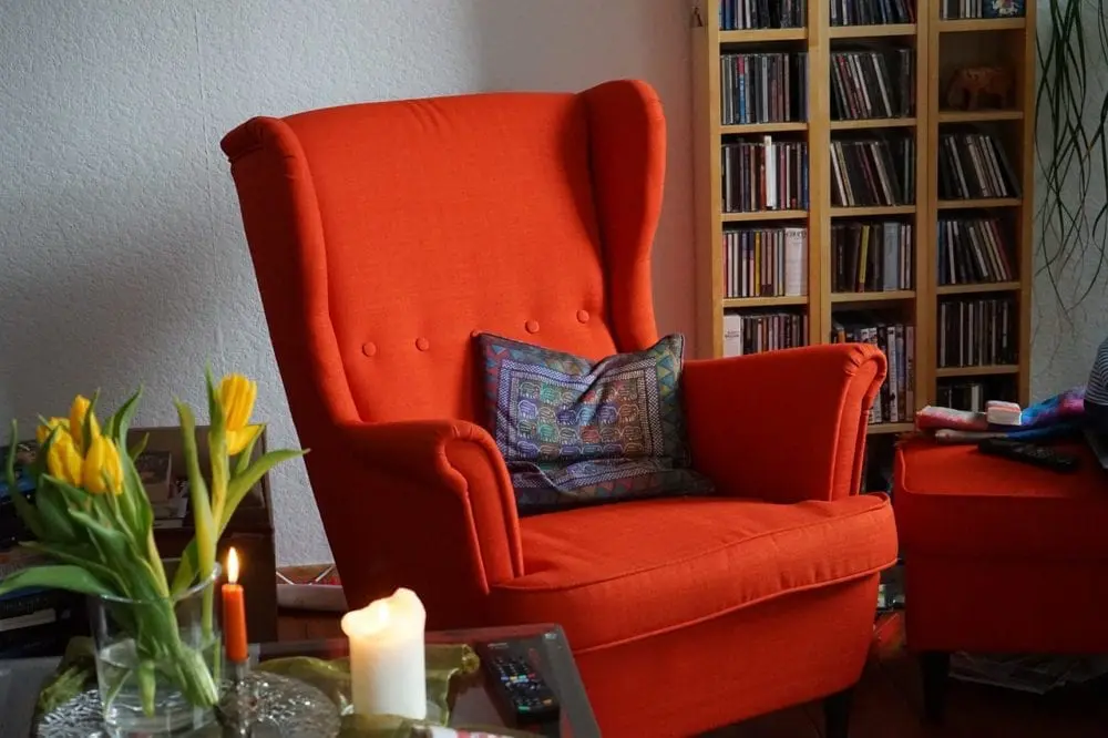 red living room chair, with purple pillow