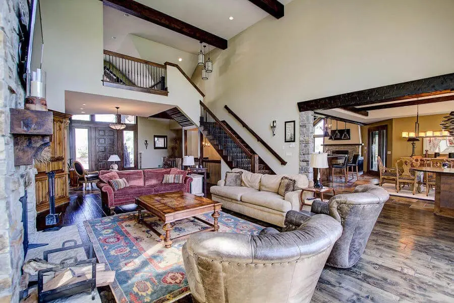 An open concept greatroom in a rustic style in a custom home from Heartle.