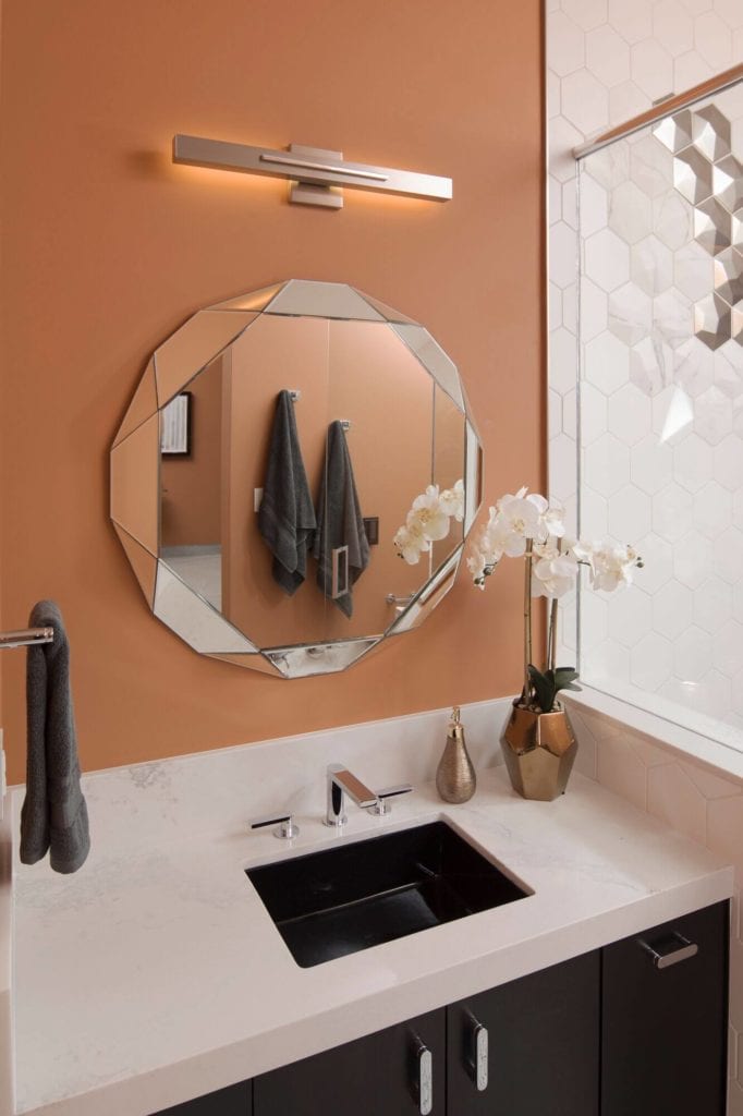 Statement mirror on the wall of a 2019 New American Home bathroom wall 