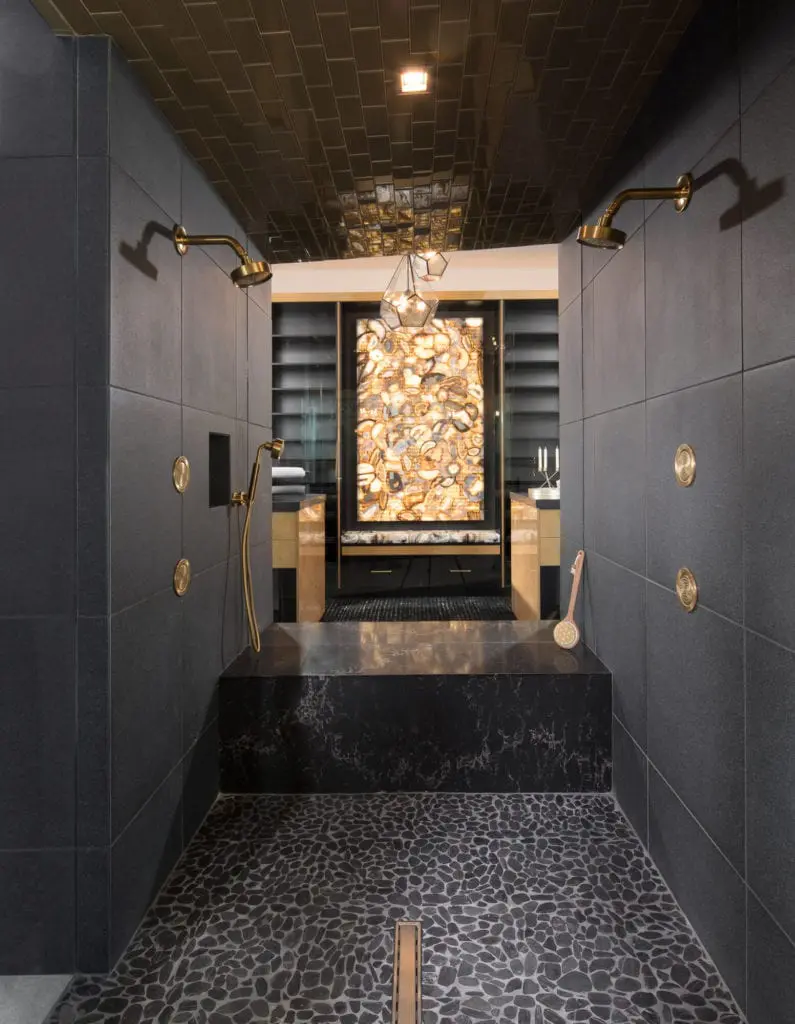 Dramatic dark tiled shower in the 2019 New American Home