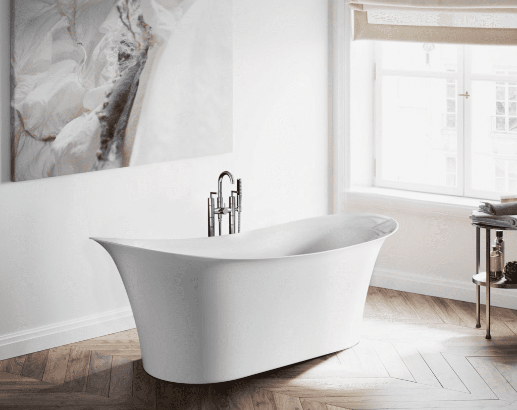 White soaking tub in neutral colored bathroom
