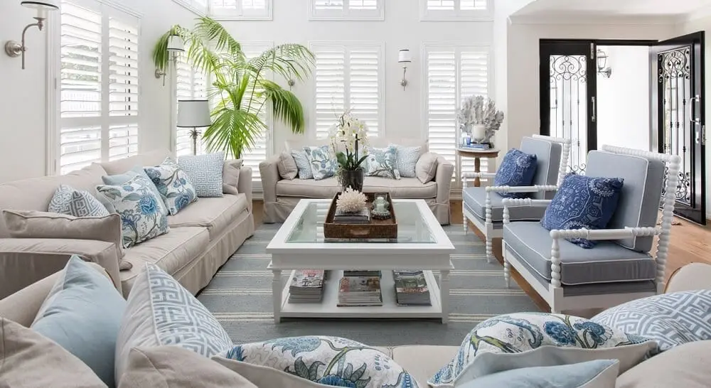 Bright living room with white walls and furniture decorated with accents in various shades of blue