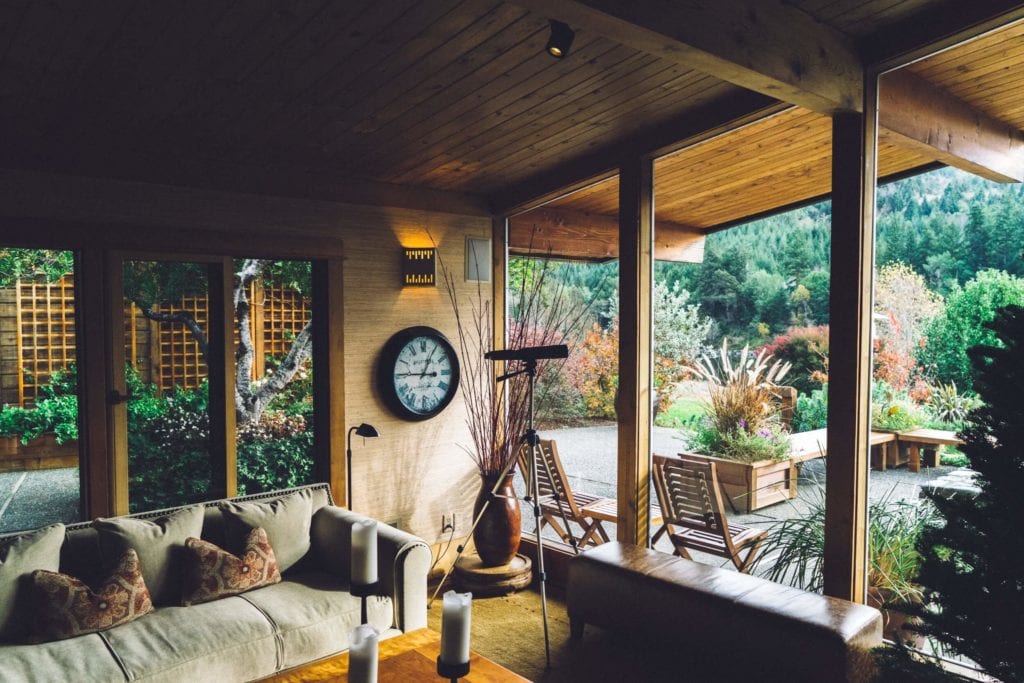 A layered and interesting home facing a garden.