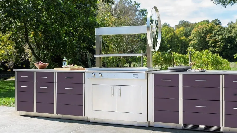 Outdoor kitchen with silver grill and wood cabinetry