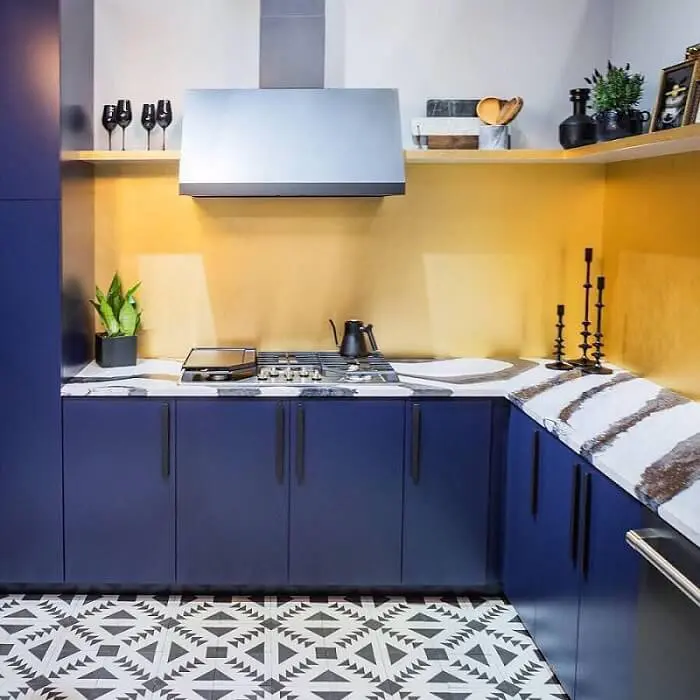 Kitchen with blue cabinets and open shelving