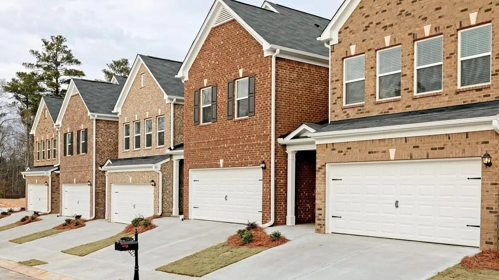 Exterior shot of townhomes in the Villages at Thorncrest by Smith Douglas Homes in Tucker, GA.