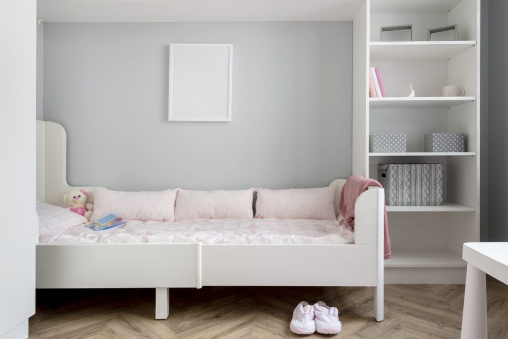 Modern child's room with a bed that doubles as extra storage space. 