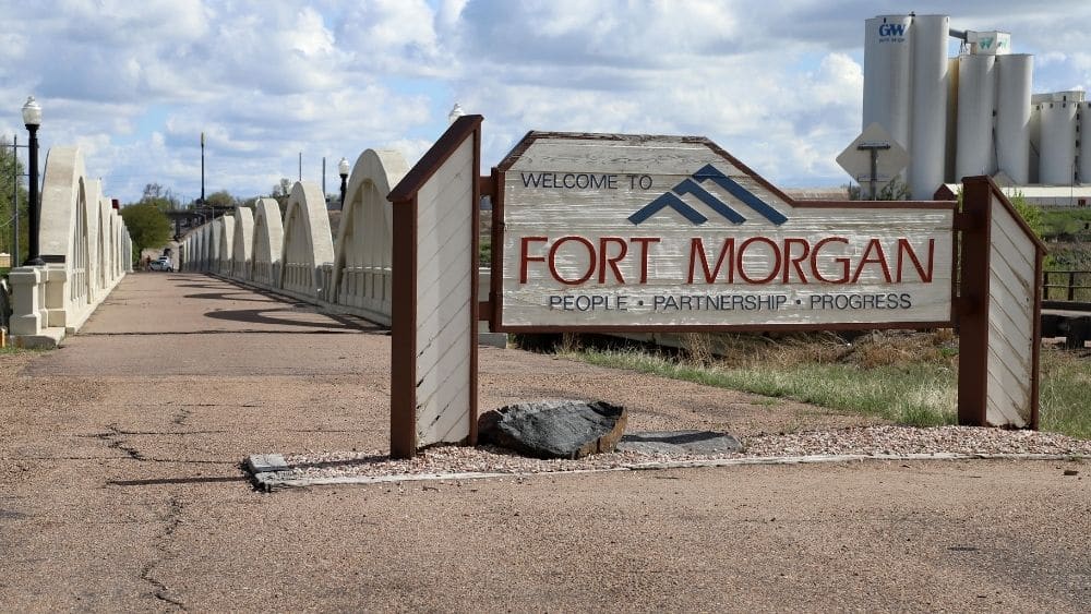 road sign that says fort morgan and below says "people, partnership, progress"