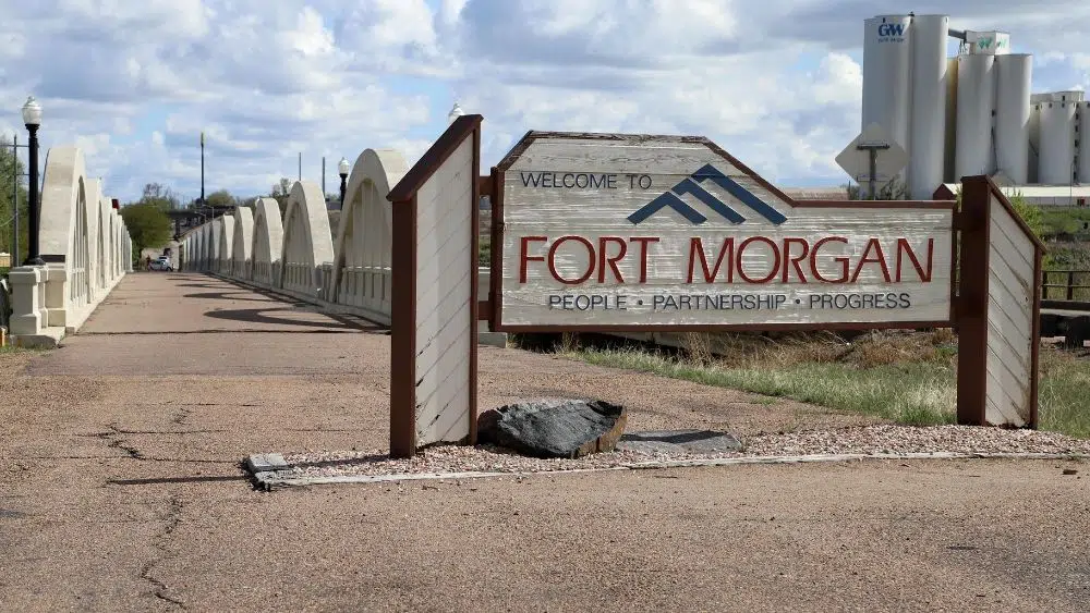 road sign that says fort morgan and below says "people, partnership, progress"
