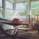 An enclosed porch with hammock