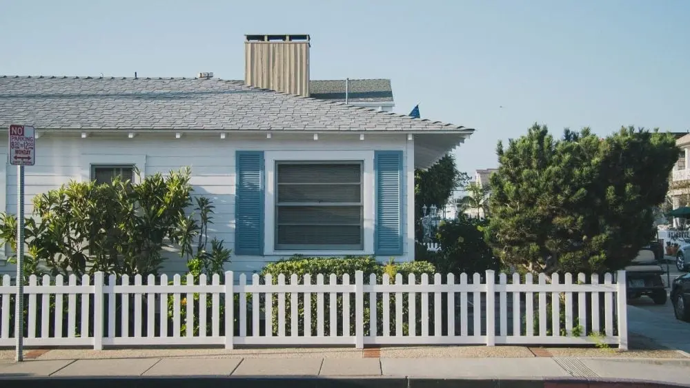 blue-house-white-picket-fence