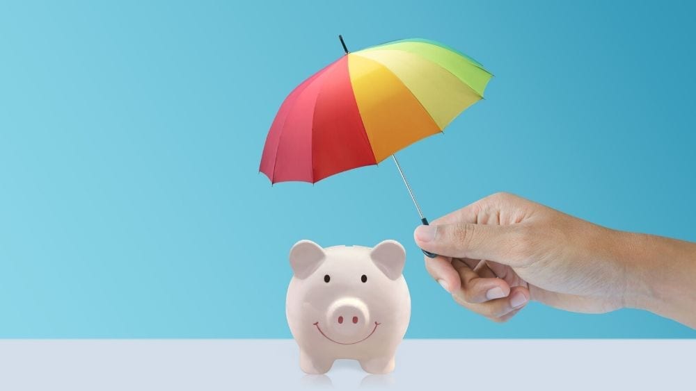 umbrella over piggy bank