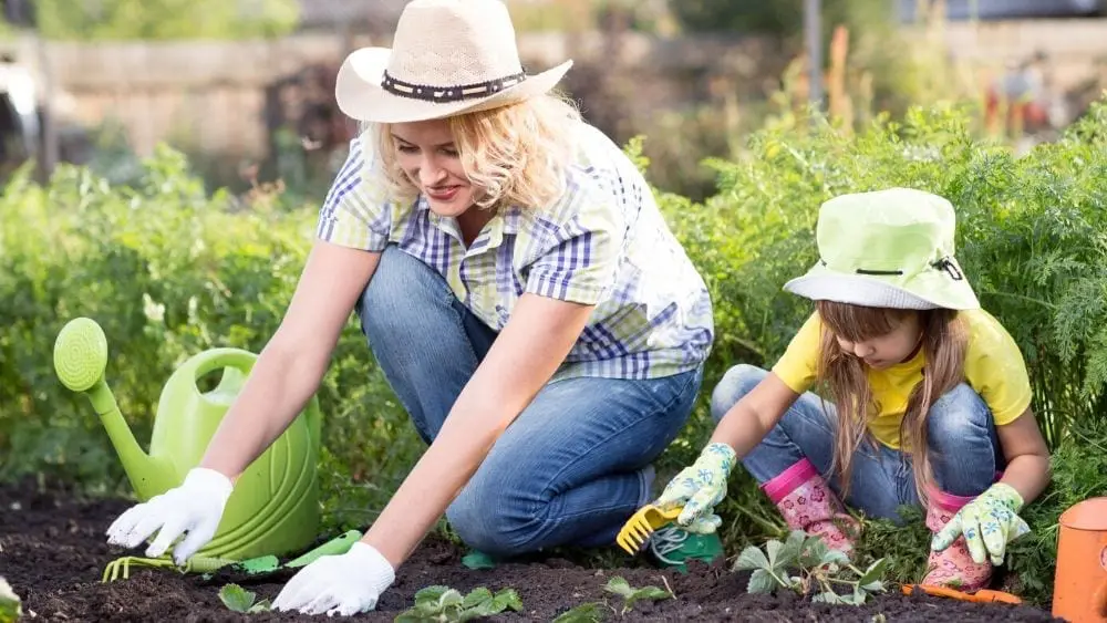 woman and little girl gardening