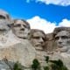 Image of the famous monument Mount Rushmore featuring the four presidents, George Washington, Thomas Jefferson, Theodore Roosevelt and Abraham Lincoln, carved into the mountainside.