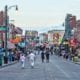 Image of Beale Street, Memphis, Tennessee, with people walking looking at the music clubs