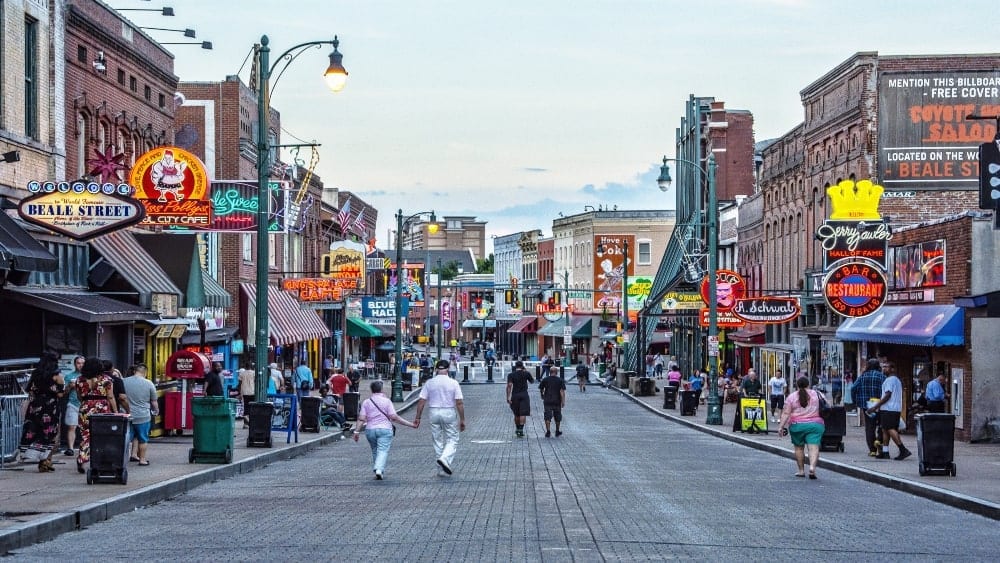 Image of Beale Street, Memphis, Tennessee, with people walking looking at the music clubs