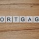Scrabble tiles arranged to spell "mortgage"