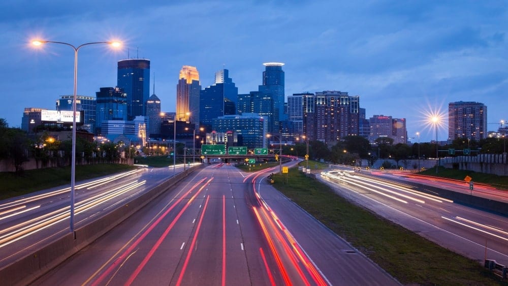 Evening skyline of Minneapolis viewed from interstate heading into downtown