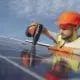 Builder installing solar panels.