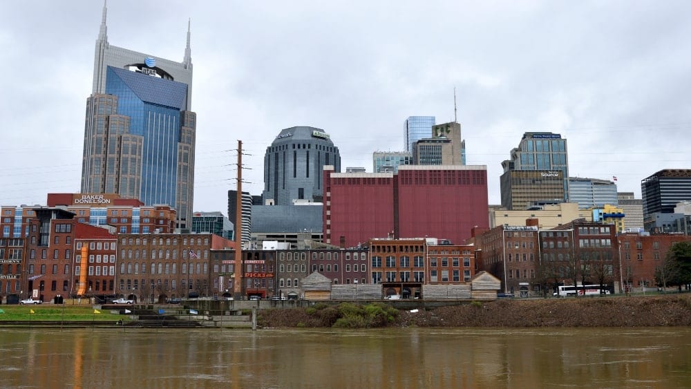 View of Nashville skyline from river with famous "Batman" building on the left