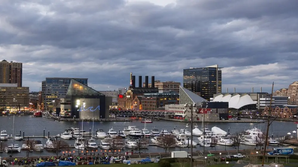 View of Baltimore's Inner Harbor with sailboats in the foreground