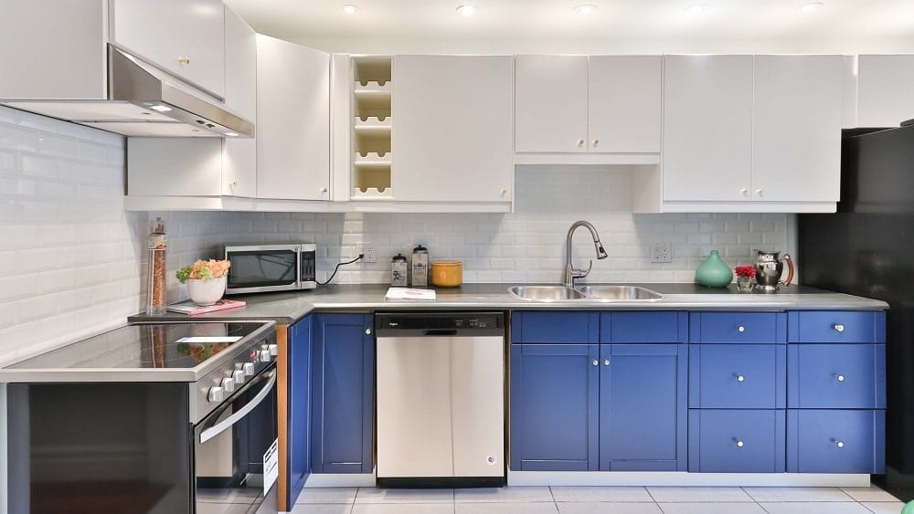 Kitchen with white and bold blue cabinets.