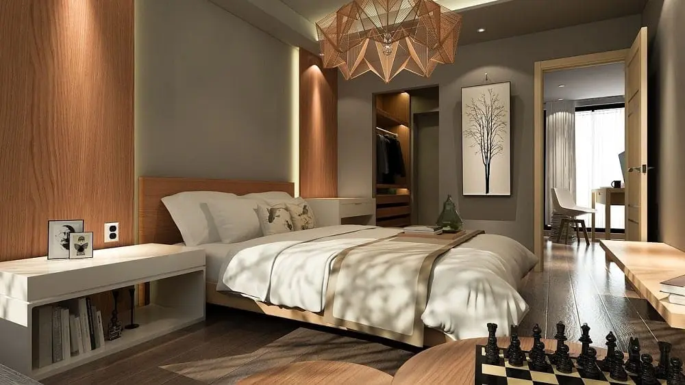 Elegant bedroom with neutral tones, geometric light, and walk-in closet.