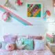 Kids bedroom with white furniture and blue and pink accent pieces.