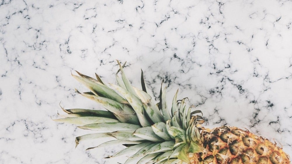 Pineapple on a marble countertop.