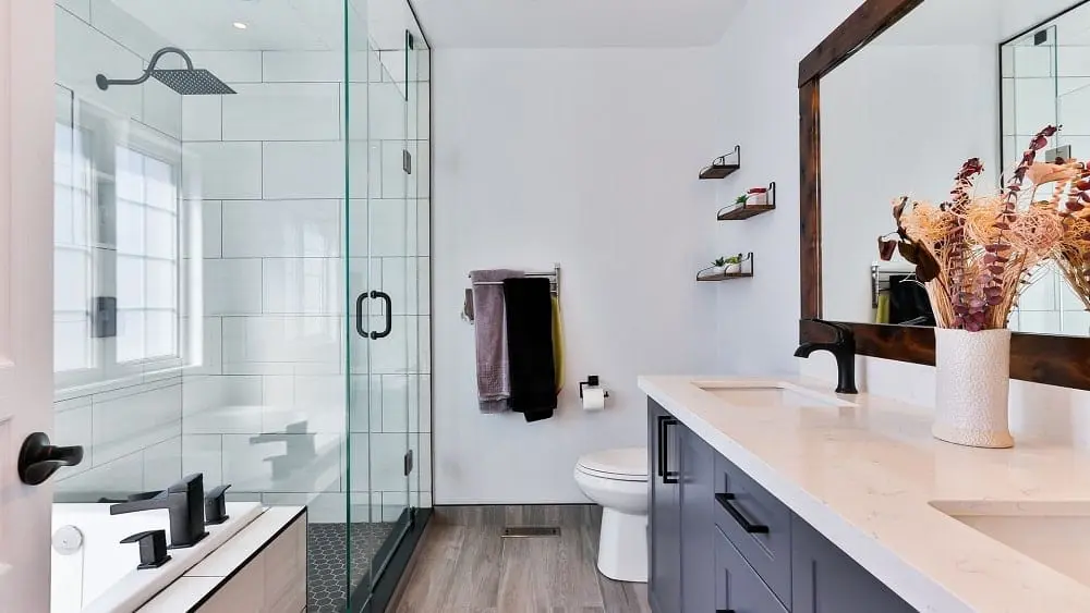 Large bathroom with double vanity and spacious walk-in shower.