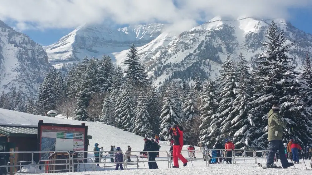 View of snowy mountains with skiers in foreground at Sundance ski resort near Provo Utah