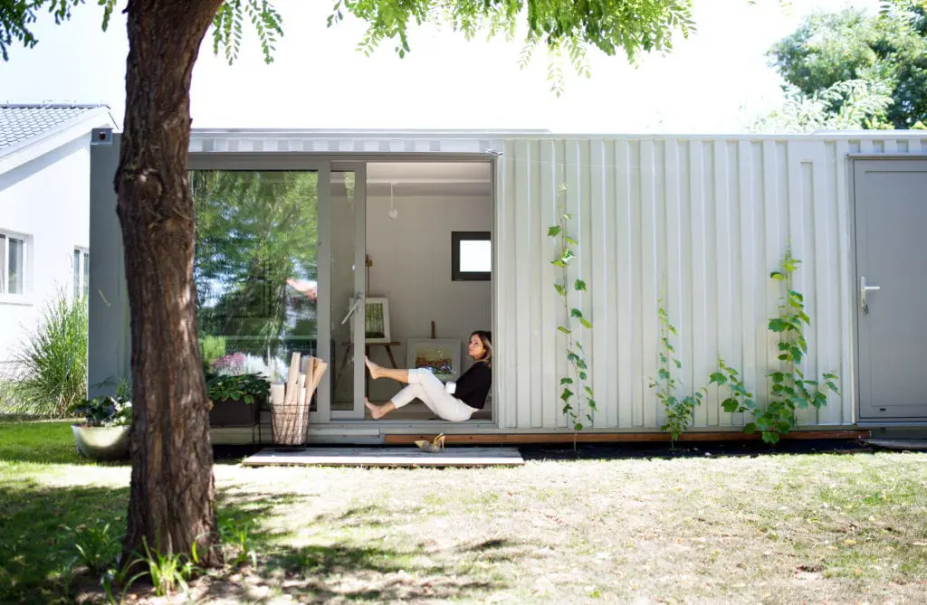 woman in container home outside