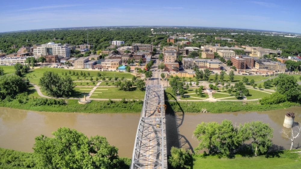 Aerial view of a bridge leading into Grand Forks.