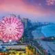 A time-lapse photo showing Myrtle Beach attractions lit up at sunset.