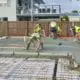 Construction workers spread and smooth concrete for a slab home foundation.