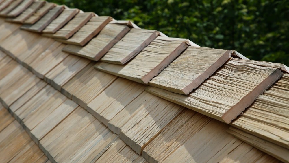 Close up of top edge of a wood shingle roof