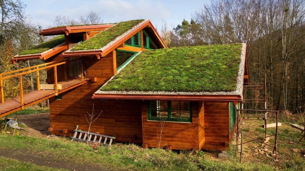 A custom wood home with multiple rooflines and multiple green roofs.