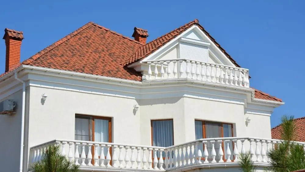 A luxury home with a clay roof