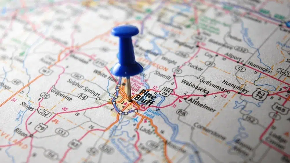 Map with a blue thumbtack on top of Pine Bluff.