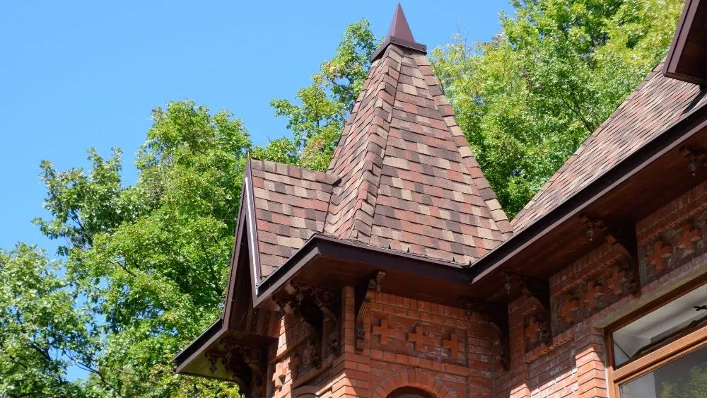 roof with shingles and red brick