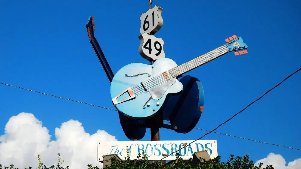 giant sign with guitar that says "The Crossroads" under it in Clarksdale, MS