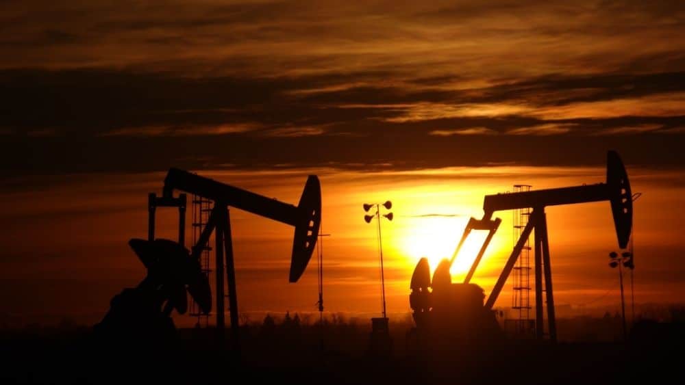 The sun sets behind oil rigs near Williston, North Dakota.