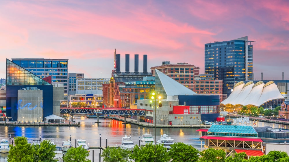 Dusk view of Baltimore Harbor with Baltimore Aquarium on the right