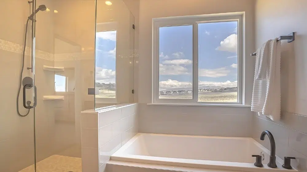Luxurious bathroom with sliding windows.