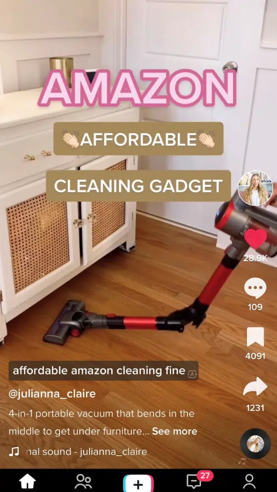 Screenshot of @julianna_claire's TikTok video reviewing a foldable vacuum cleaner.