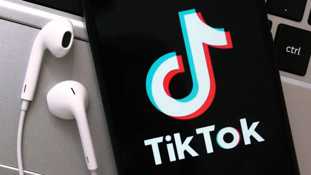 iPhone showing the TikTok logo.