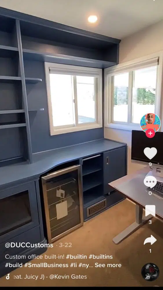 Screenshot from @duccustoms' TikTok video showing a blue built-in coffee and wine station in an office.