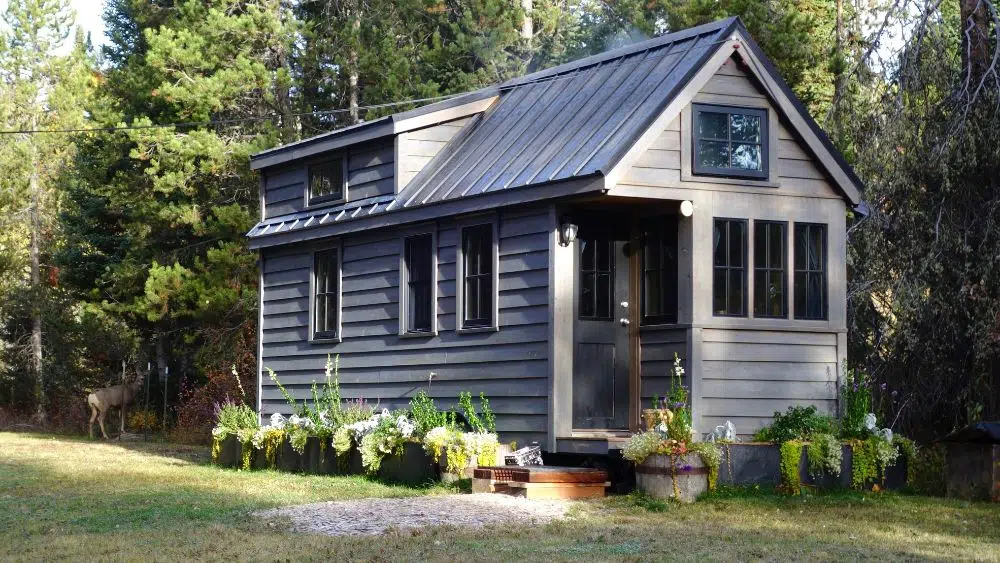 tiny home in the woods with flowers michigan